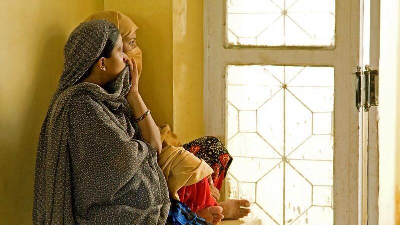 Women looking out of a window